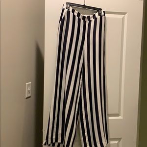 Pants black & white stripes.
